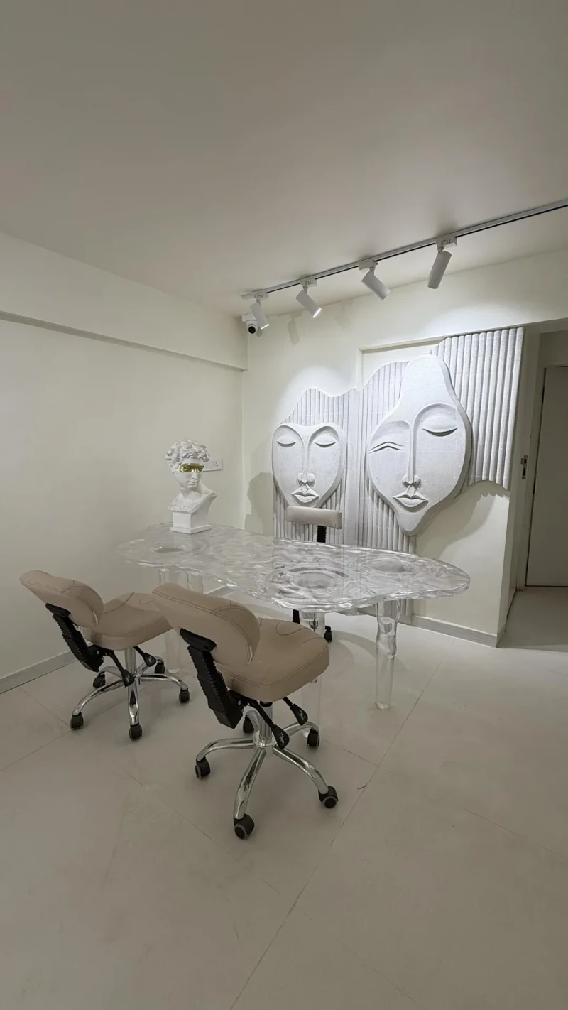 Inside Ally 21 Aundh: white sculpted walls and a marble floor