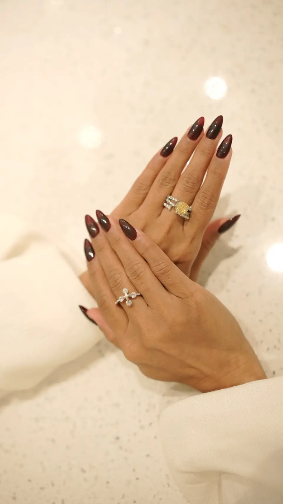 Glossy burgundy almond nail extensions, done at Ally 21